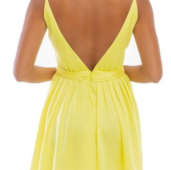 Turn heads in this skater cut plunging yellow sati - Picture 2 of 2